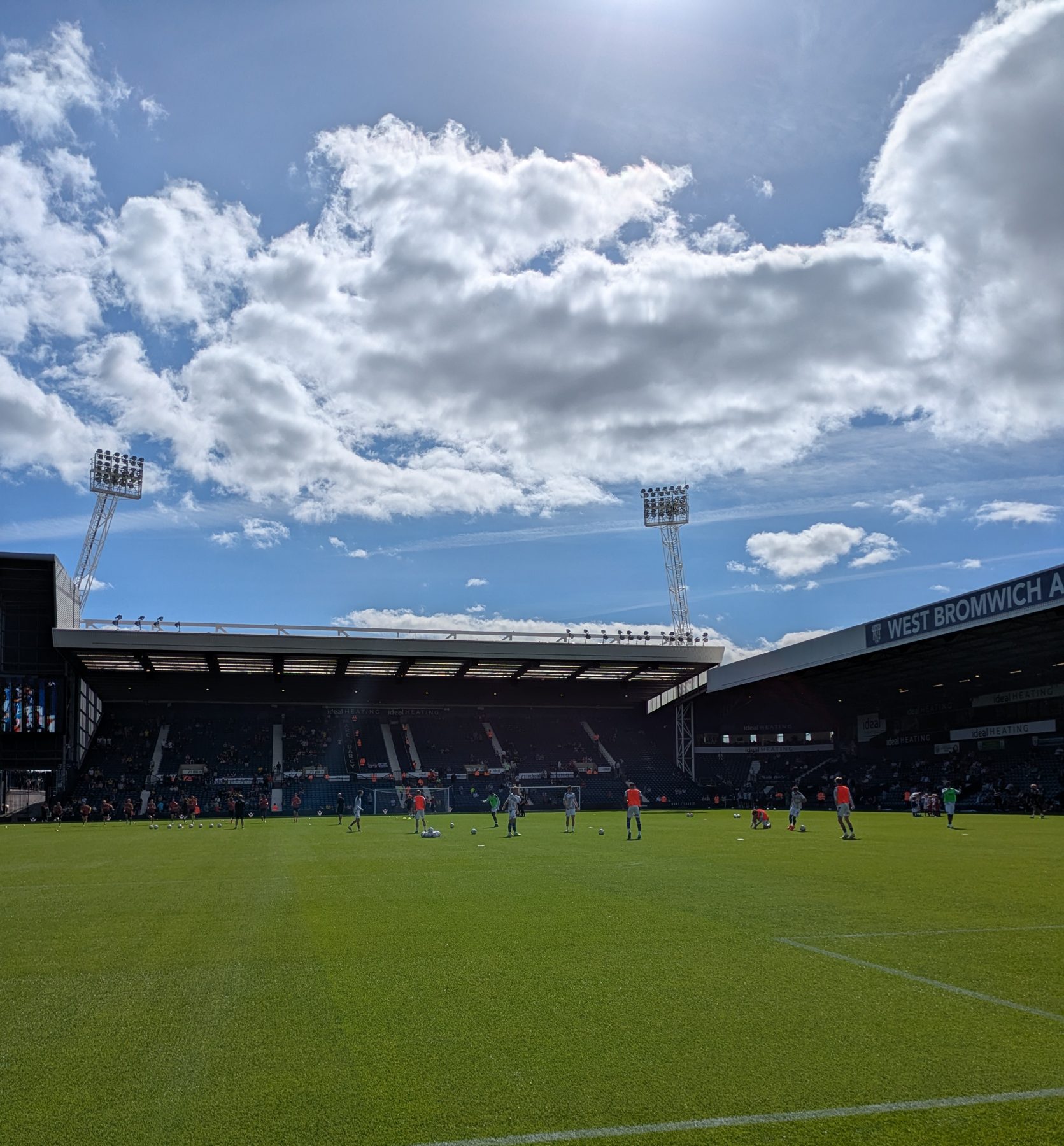 Players warming up under blue skies at The Hawthorns